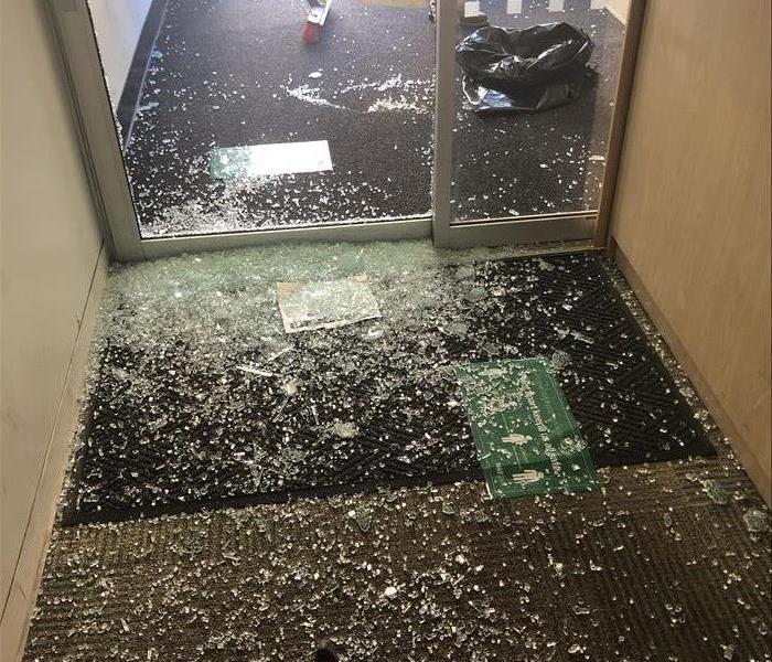 Broken glass all over the floor of a business