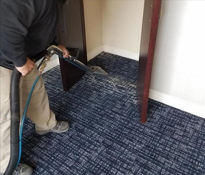 SERVPRO tech cleaning the carpet of an office in Philadelphia, PA