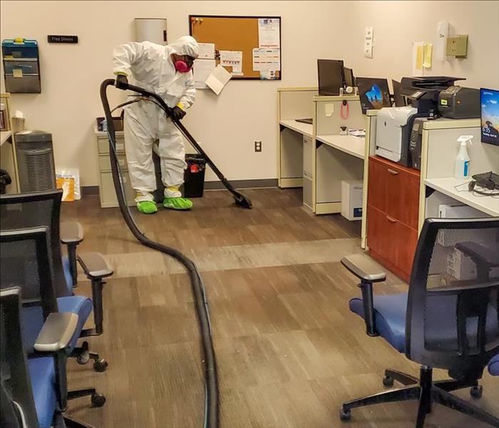 SERVPRO tech in PPE cleaning a business